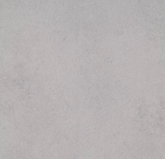 Fürbo Allura Dryback Vinylboden in Light Cement, 0,55 mm, mit Klebevinyl, zeigt die Textur und Farbe des Bodenbelags.