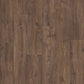 Quick-Step Vinylboden PUGP Klebevinyl 40199 Herbst Eiche Schokolade mit Holzmaserung und warmem Braunton, liegend auf einer glatten Oberfläche